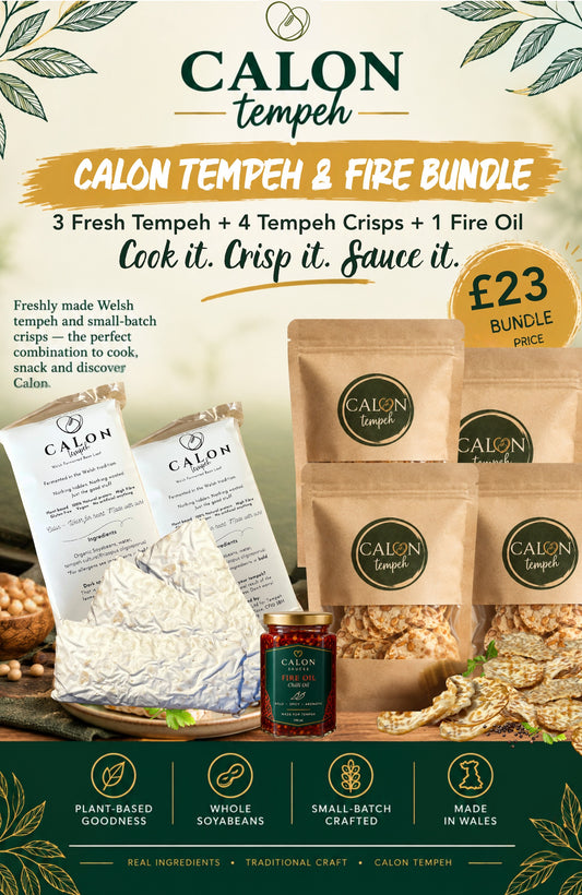 Promotional graphic for the Calon Tempeh and Fire Bundle, featuring three fresh tempeh cubes, four small-batch tempeh crisps in brown paper bags on a styled wooden board, and a glass jar of Calon Tempeh Sauces Fire Oil Chilli Oil
